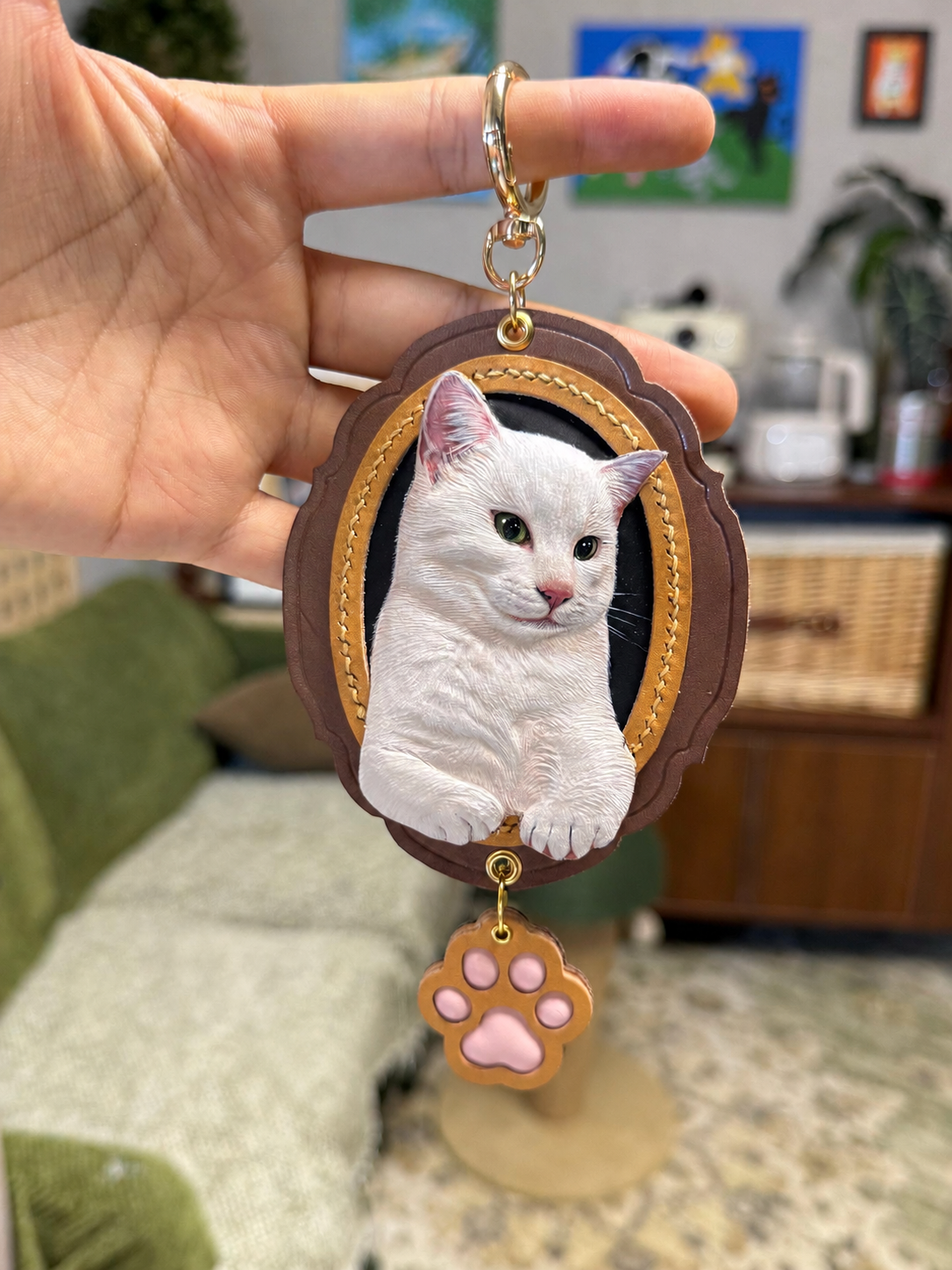Close-up of the completed brown scalloped leather white cat portrait charm